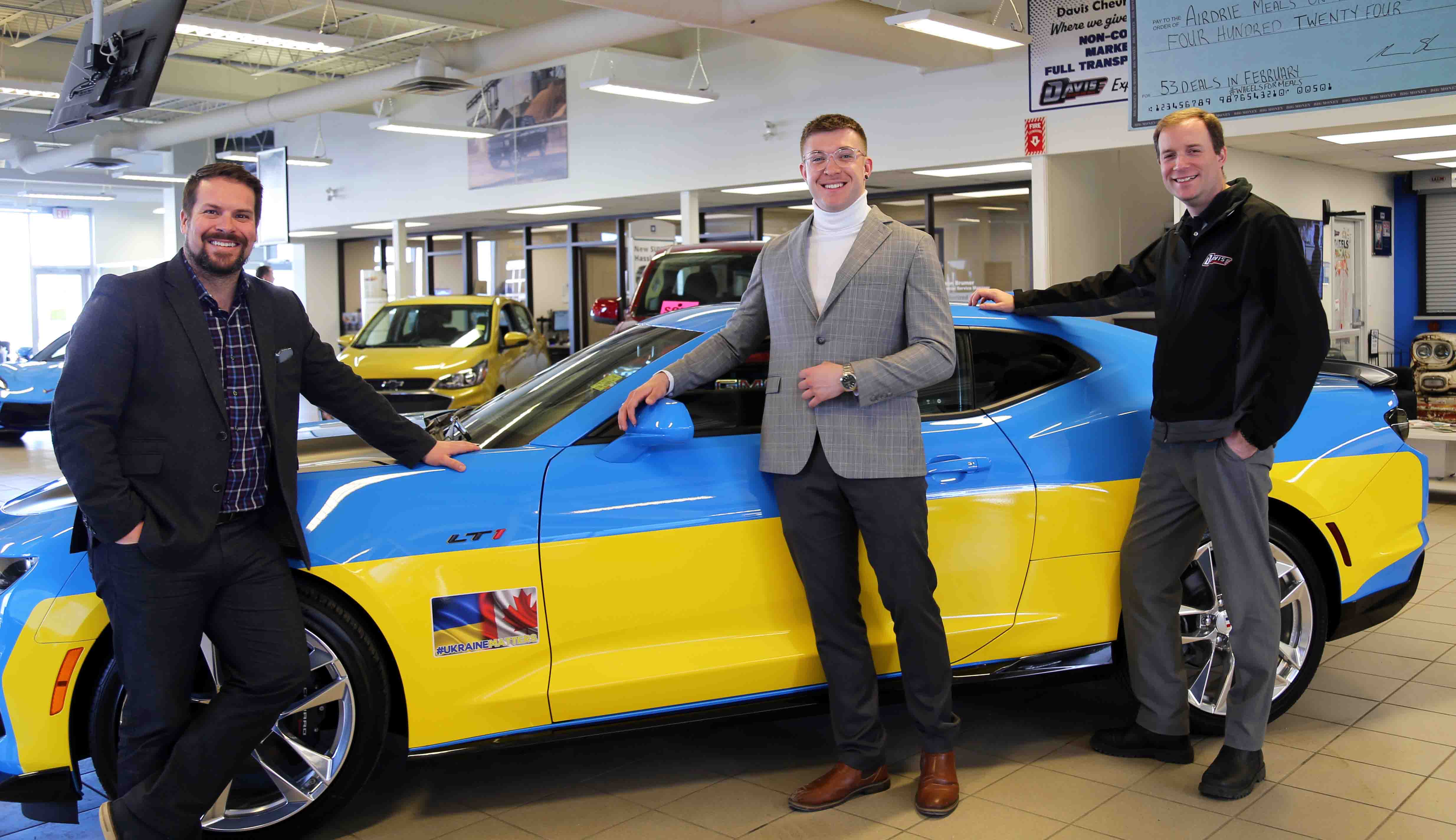 Airdrie car dealership revs up support for aide in Ukraine